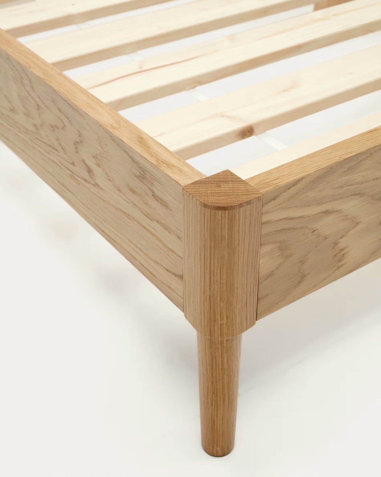 Solid oak craftsmanship highlighted in bed’s smooth finish