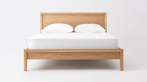 The Echelon Platform Bed by AR4HandsFurniture. Front view of the minimalist wooden bed.