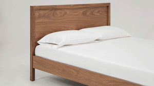 A close-up view of the corner of the Echelon Bed frame, showing craftsmanship.