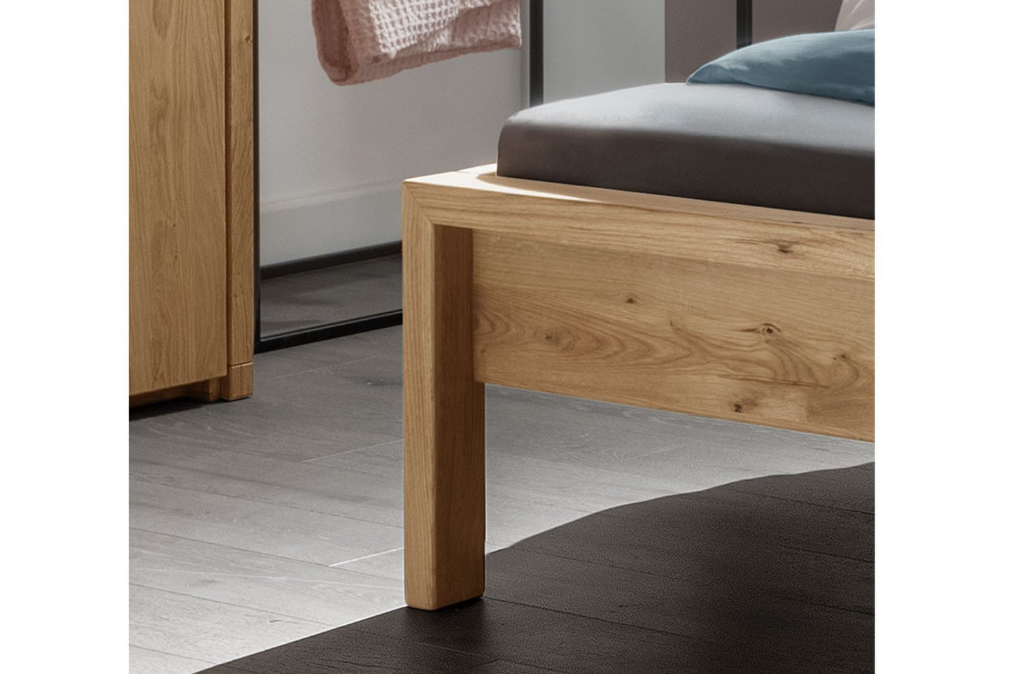 Low-angle view emphasizing the bed's harmonious and low-to-the-ground profile.