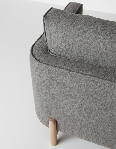 Close-up of Dark Grey Textured Fabric Upholstery on Minimalist Sofa