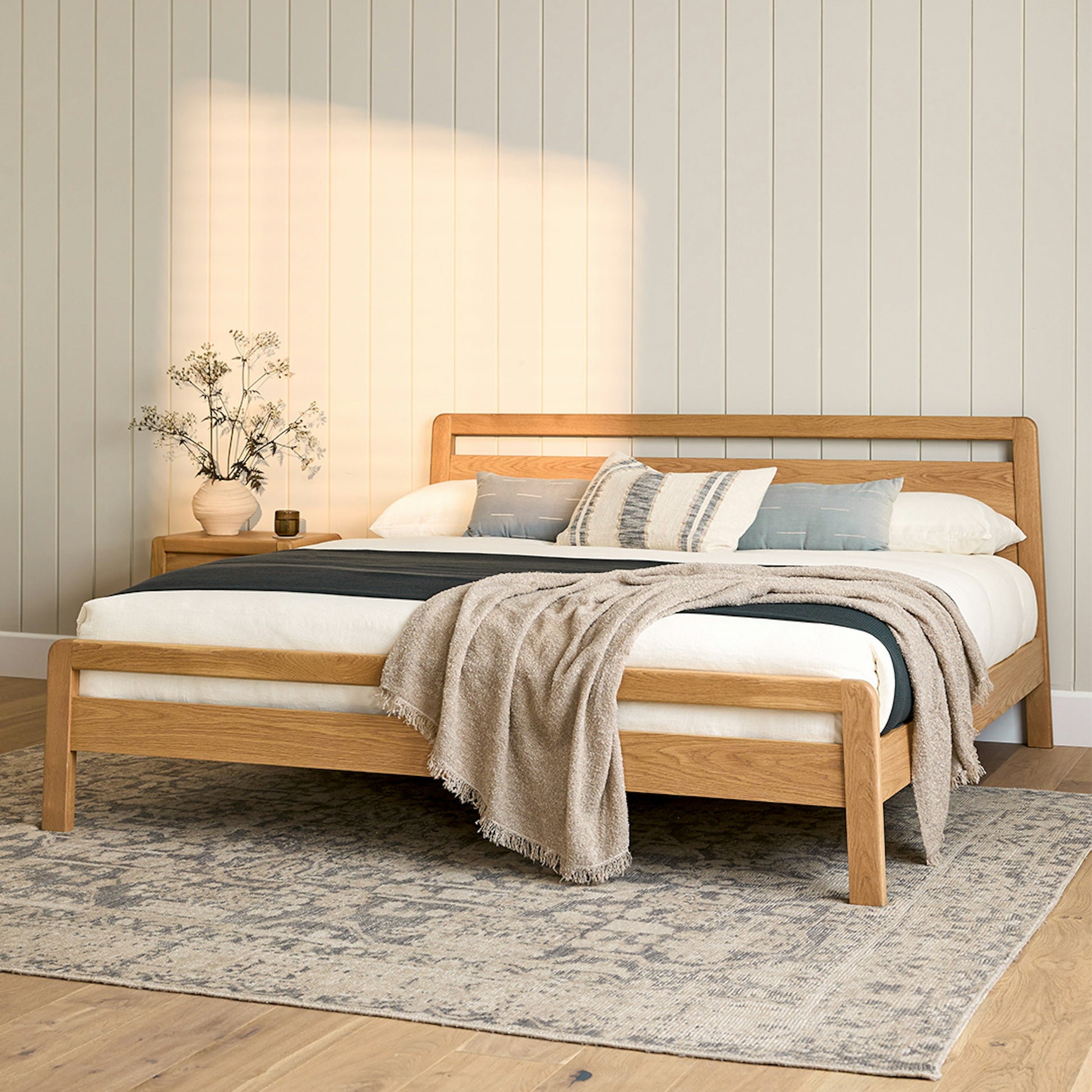 "The Zen Oak Bed by AR4HandsFurniture. A minimalist, Scandinavian-inspired bed with a natural oak finish and slanted legs."